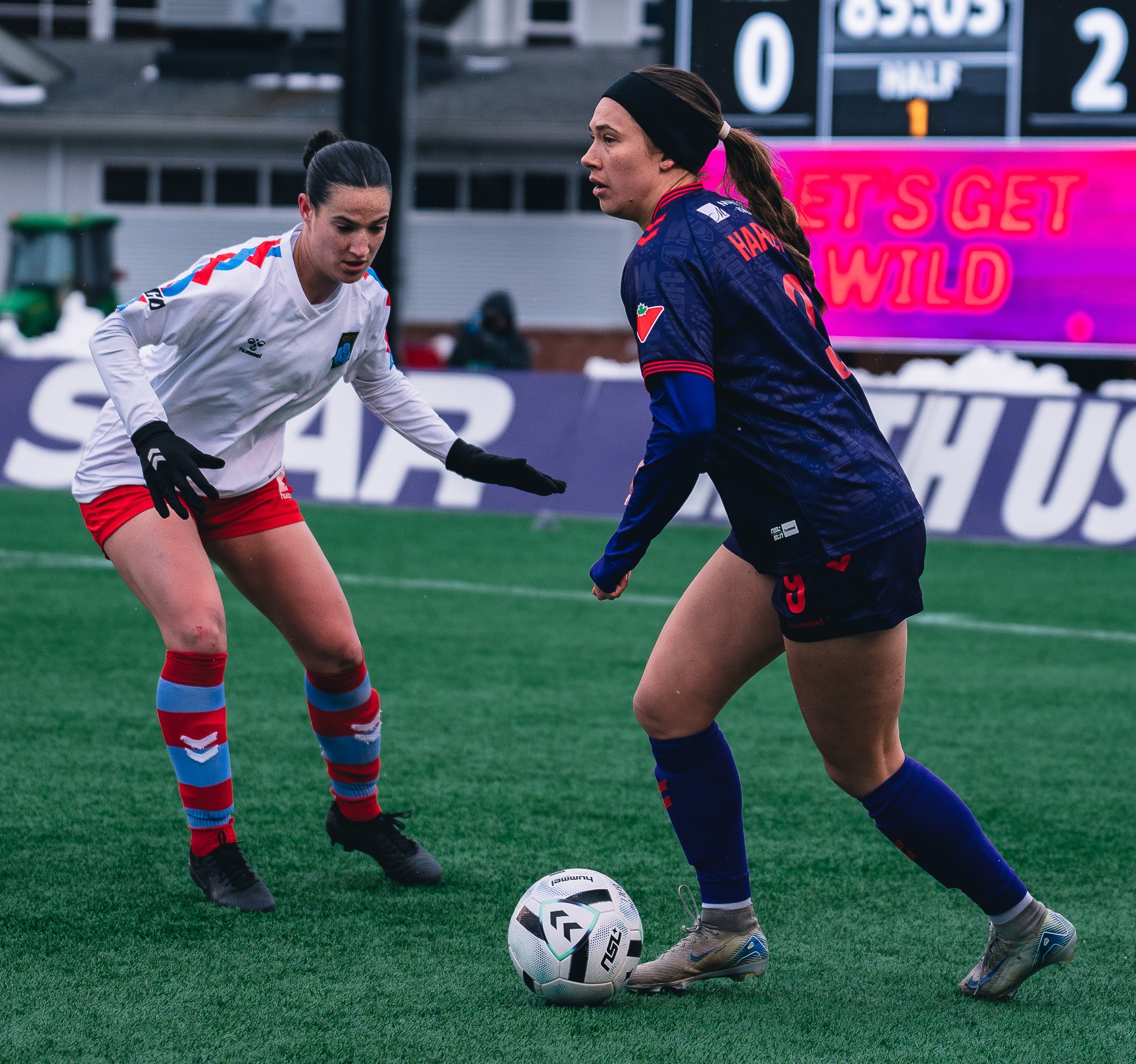 Kathryn Harvey makes a play against a Montreal Rose player at McMahon Stadium in Calgary