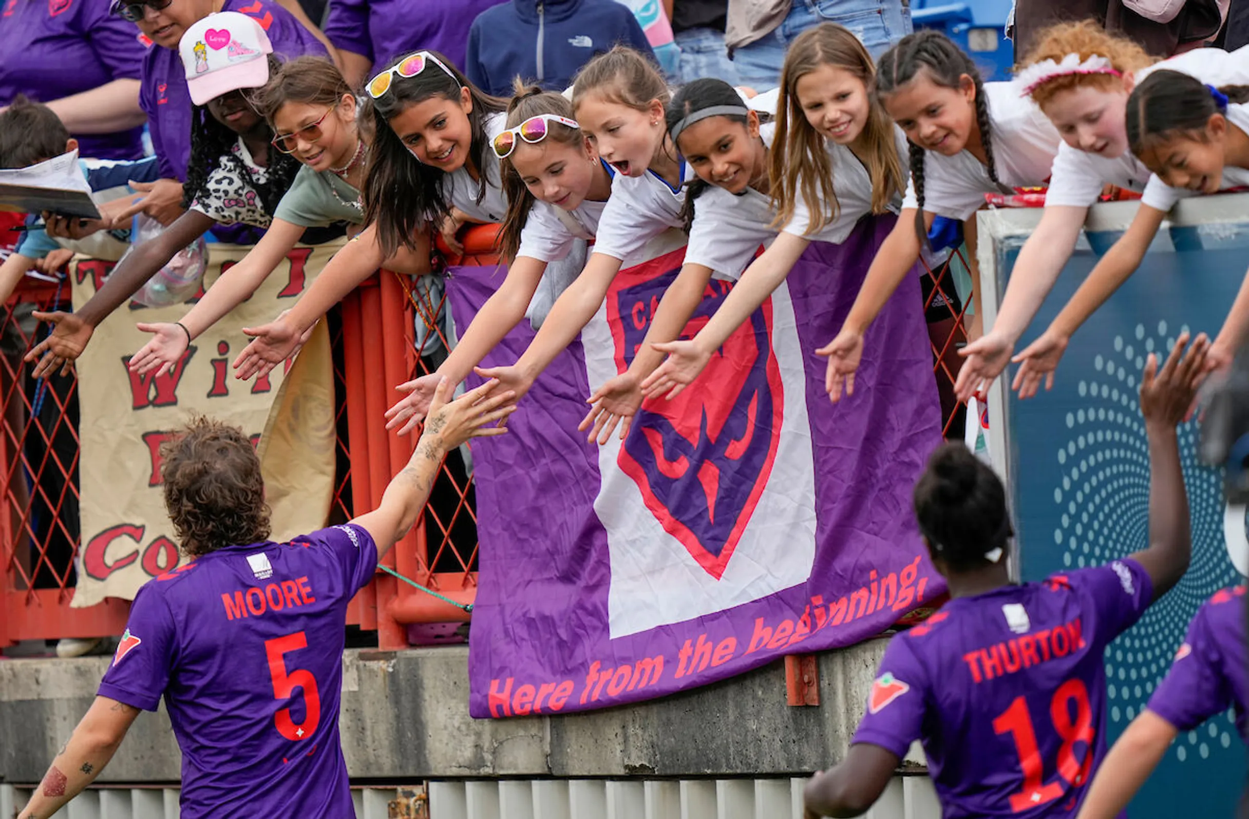 Calgary Wild FC supporters celebrating in the stands