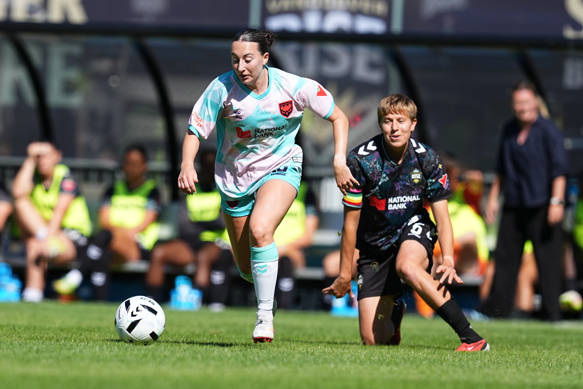 Josie Aulicino dribbles past a Vancouver Rise defender