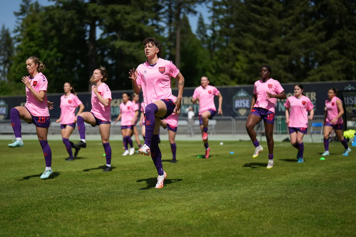 Players warming up on the pitch